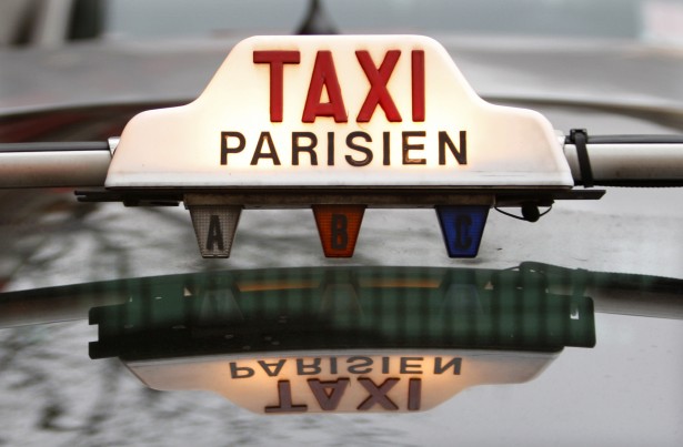 The top of a taxi is seen in downtown Paris